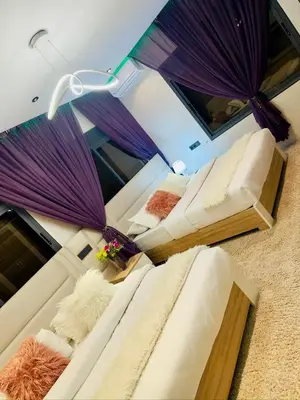 a room with three beds with umbrellas at la vue panoramique in Marrakech
