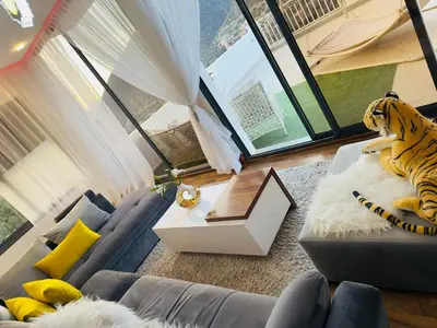 a living room with a tiger sitting on a couch at la vue panoramique in Marrakech