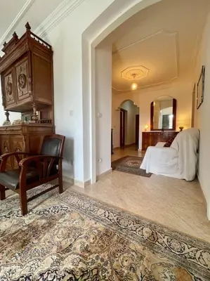 a bedroom with a bed and a desk and a chair at Magnifique villa - 5 chambres - Ifrane in Ifrane