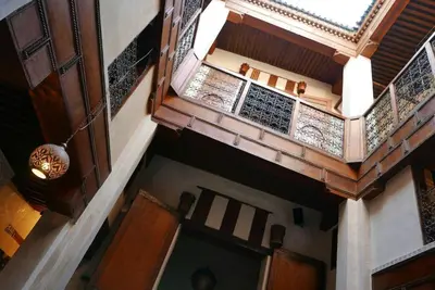 an overhead view of a building with a balcony at House in the old Medina of Fez in Fès al Bali