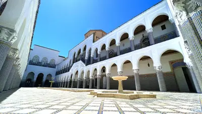 a building with a fountain in the middle of a courtyard at Youssef in Fès