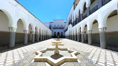 a courtyard with a fountain in the middle of a building at Youssef in Fès