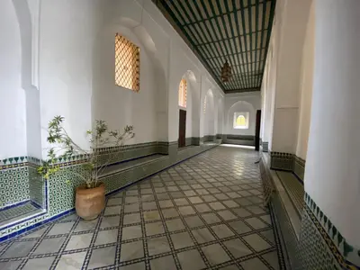 a hallway with a potted plant in a building at Youssef in Fès