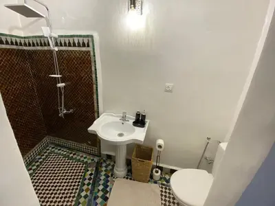 a bathroom with a shower and a sink at Youssef in Fès