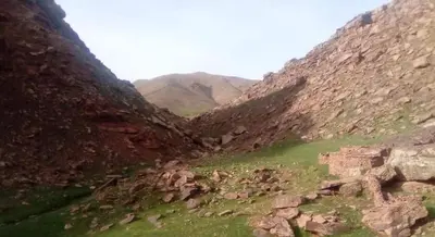 a view of a canyon with mountains in the background at Gite Oukaimeden in Oukkainrdem