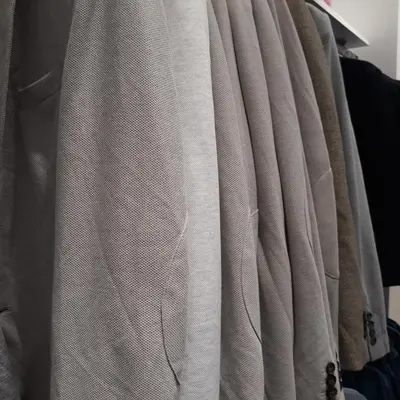 a bunch of clothes hanging on a rack at BRYKHOME in Fès