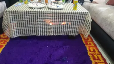 a table with a purple and white table cloth at BRYKHOME in Fès