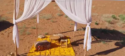 an overhead view of a tent in the desert at Erg Chigaga Regency Camp in El Gouera
