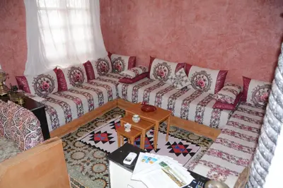 a living room with a couch and a table at Dar El Karam Fez in Fès
