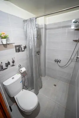 a bathroom with a toilet and a shower at Dar El Karam Fez in Fès