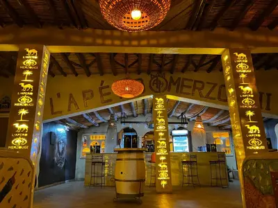 a wine tasting room with a bar in a building at Kasbah Merzouga in Merzouga