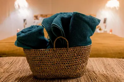 a basket filled with towels sitting on a table at Soleil Camp & Camel Trekking in Merzouga