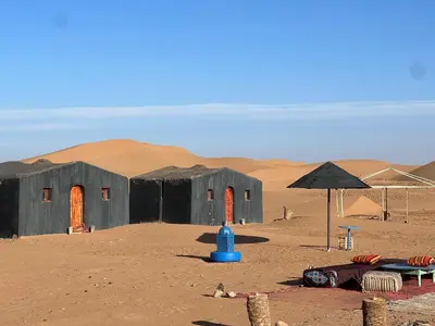 a building in the middle of the desert at Camp Mbark authentic in Mhamid