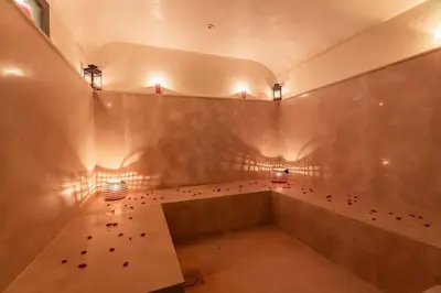 a room with a bunch of red flowers on the wall at Somptueuse Villa louée avec le personnel de maison in Marrakech