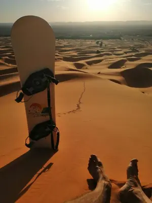 a snowboard in the sand in the desert at Nirvana Desert Camp in Merzouga