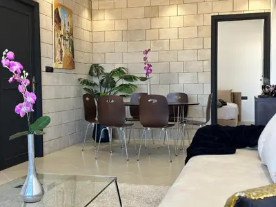 a living room with a table and four chairs at Luxury appartement Fes in Fès