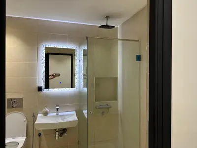 a bathroom with a sink and a shower at Luxury appartement Fes in Fès