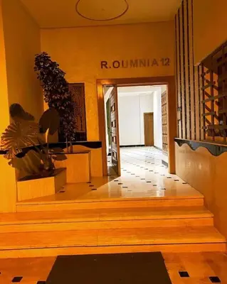 a building with a staircase leading to a building with a sign at Appart luxueux sécurisé parking 10 min Medina in Fès