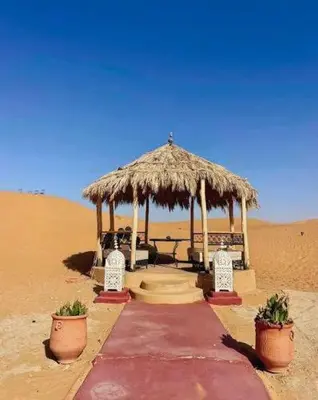 a gazebo in the middle of the desert at Erg Chegaga Camp Excursions in Mhamid