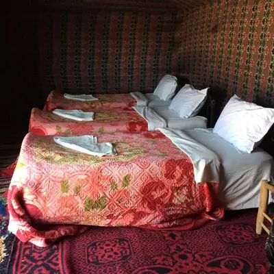 two beds sitting next to each other in a room at Bivouac la fibule des Dunes in Merzouga