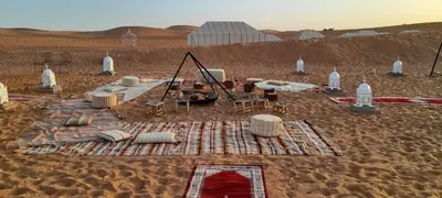 a desert encampment in the middle of the desert at LUXURY Camp in Merzouga