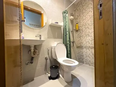 a small bathroom with a toilet and a sink at Appartement Luxueux, 2 chambres, à 300m de la Gare de train in Fès