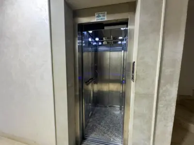 an elevator in a building with its door open at Appartement Luxueux, 2 chambres, à 300m de la Gare de train in Fès