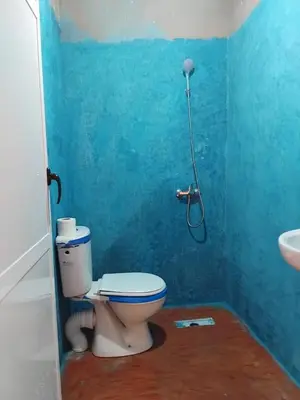 a bathroom with a toilet and a sink at Pergolas Tamakouchte in Ouarzazate