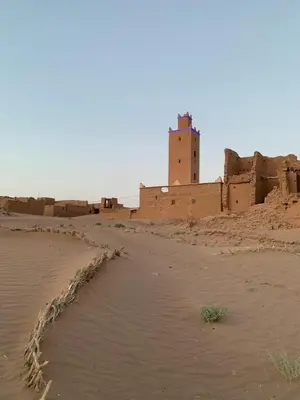 a view of a desert with a building in the background at Dar Nuyum in Bou Nou