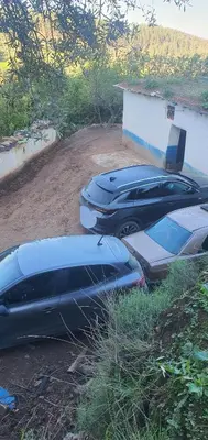 a group of parked cars parked next to a building at Gîte tazekka in Taza