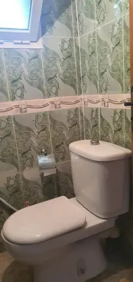 a bathroom with a toilet and a wall at Gîte tazekka in Taza