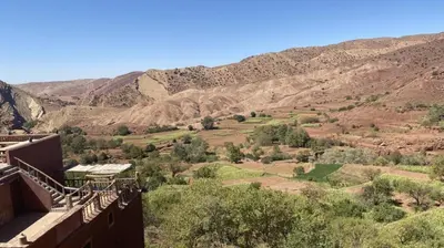 a view from the balcony of a house in the mountains at Riad Bouchahoud Hotel in Telouet in Telouet