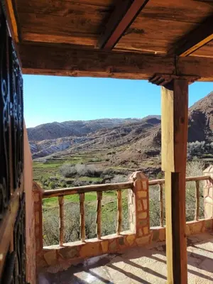 a view of the mountains from the porch of a house at Riad Bouchahoud Hotel in Telouet in Telouet