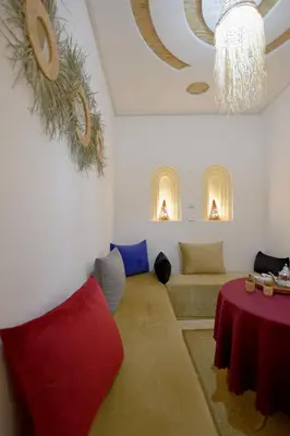 a living room with a couch and a table at RIAD dreams dades in Tamellalt