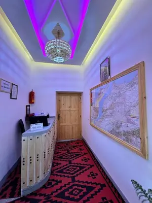 a room with a hallway with a ceiling with purple lights at RIAD dreams dades in Tamellalt