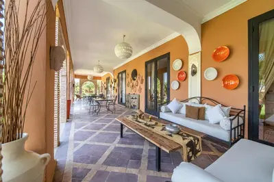 a living room with a couch and a table at Villa Chems - Al Ouidane in Marrakech