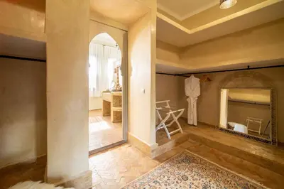 a hallway with a mirror and a dressing room at Villa Chems - Al Ouidane in Marrakech