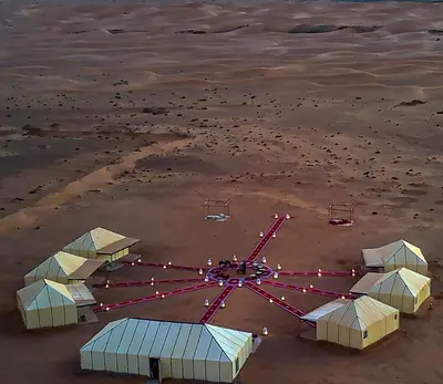 an aerial view of a crab island in the water at Sahara Dunes Camp in Merzouga