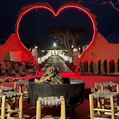 a heart themed room with a fire pit and lights at Merzouga Top Luxury Camp in Merzouga