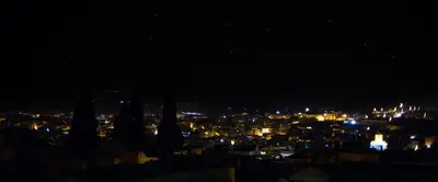 a view of a city at night with lights at Riad Damia Suite & Spa in Fès