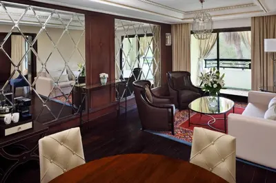 a living room with chairs and a table at Fes Marriott Hotel Jnan Palace in Fès
