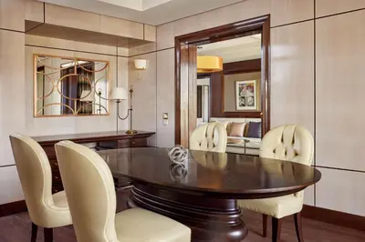 a dining room with a table and chairs at Fes Marriott Hotel Jnan Palace in Fès