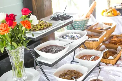 a buffet of food and flowers on a table at Zahrat Al Jabal in Fès