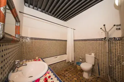 a bathroom with a sink and a toilet at Riad Sara in Fès