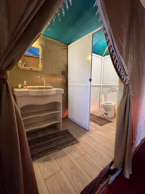 a bathroom with a sink and a toilet at Luxury Camp Merzouga & Activities in Merzouga