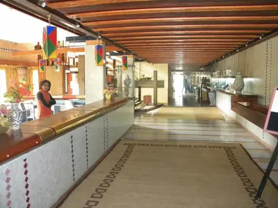 a long hallway with a bar in a restaurant at Sidi Harazem in Fès