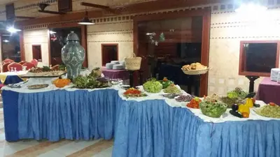 a table filled with different types of food on at Sidi Harazem in Fès