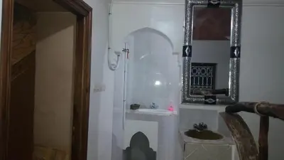 a bathroom with a sink and a mirror at Gîte Assafar in Kalaat MGouna
