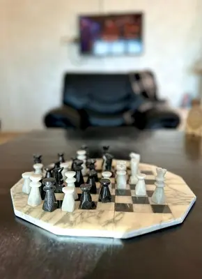 a chess board sitting on top of a table at ATGAL Ferme D'hote in Azrou