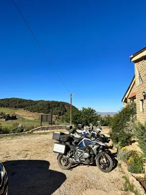 a row of motorcycles parked next to a building at ATGAL Ferme D'hote in Azrou